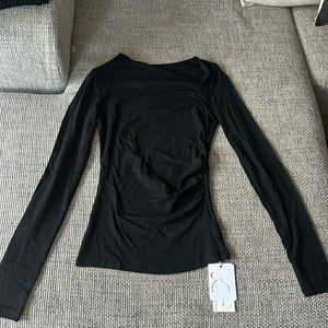 Brand new with tags - Asymmetric long black top.